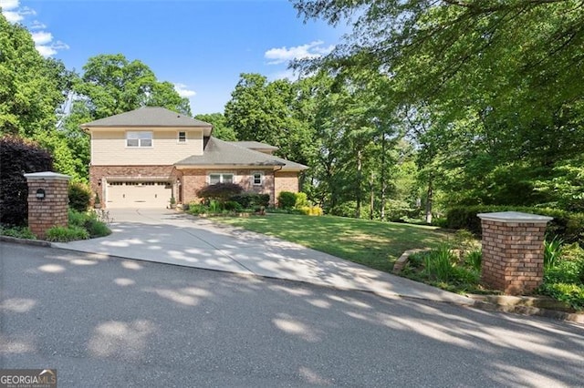 5816 Chamblee Dunwoody, Atlanta, GA 30338 - view of front of home featuring concrete driveway, an attached garage, brick siding, and a front lawn