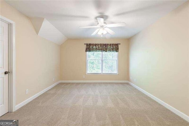 5065 Hickory Hills Dr, Woodstock, GA 30188 - bonus room featuring light carpet, a ceiling fan, baseboards, and lofted ceiling