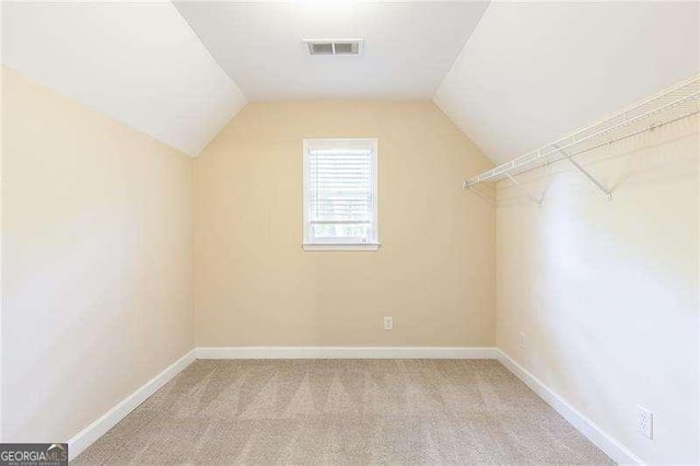 5065 Hickory Hills Dr, Woodstock, GA 30188 - bonus room featuring vaulted ceiling, carpet flooring, and baseboards