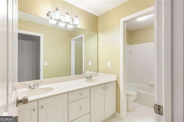 5065 Hickory Hills Dr, Woodstock, GA 30188 - full bathroom featuring toilet, double vanity, tub / shower combination, and tile patterned flooring