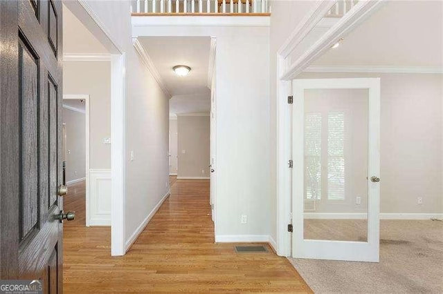 5065 Hickory Hills Dr, Woodstock, GA 30188 - foyer entrance featuring ornamental molding, light wood-type flooring, and baseboards