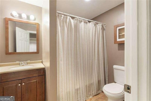 5065 Hickory Hills Dr, Woodstock, GA 30188 - full bath featuring toilet, vanity, a shower with shower curtain, and tile patterned flooring