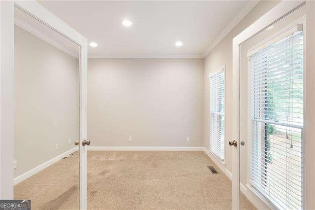 5065 Hickory Hills Dr, Woodstock, GA 30188 - unfurnished room with french doors, light colored carpet, healthy amount of natural light, crown molding, and baseboards