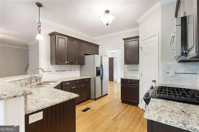 5065 Hickory Hills Dr, Woodstock, GA 30188 - kitchen with stainless steel refrigerator with ice dispenser, dark brown cabinets, backsplash, and ornamental molding