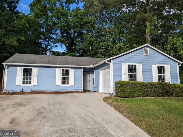 6260 Marbut Farms Ter, Lithonia, GA 30058 - view of front facade with concrete driveway, a garage, and a front lawn