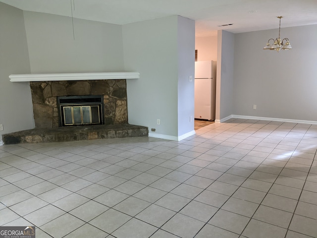 6260 Marbut Farms Ter, Lithonia, GA 30058 - unfurnished living room with a chandelier, a fireplace, tile patterned flooring, and baseboards