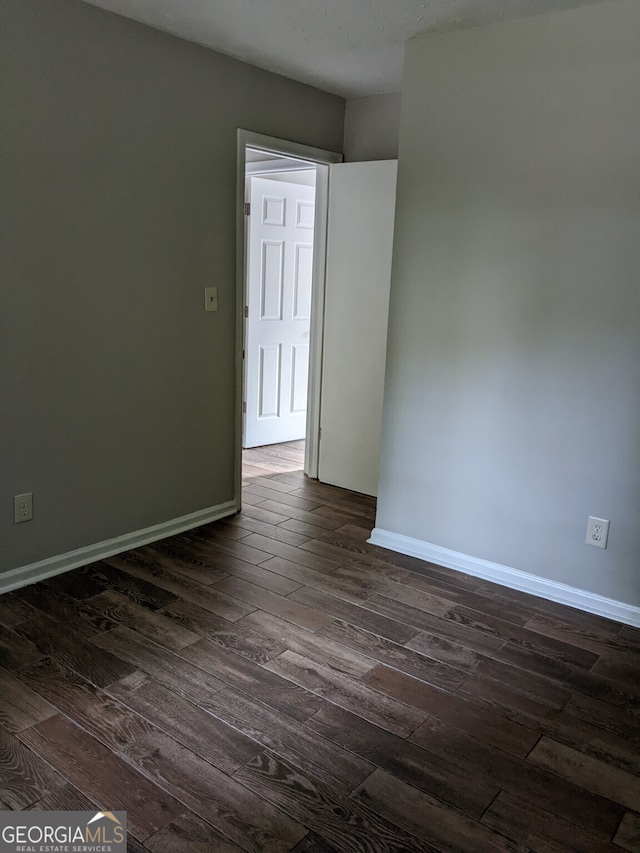 6260 Marbut Farms Ter, Lithonia, GA 30058 - unfurnished room with dark wood-style floors and baseboards