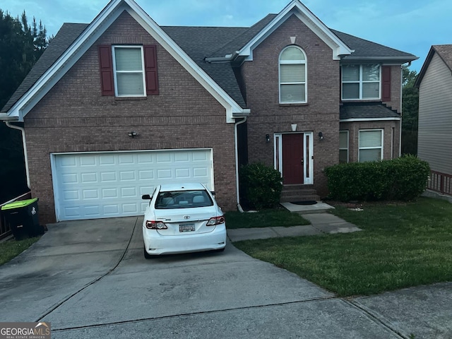 10937 Southwood Dr, Hampton, GA 30228 - traditional-style house featuring concrete driveway, a garage, and brick siding