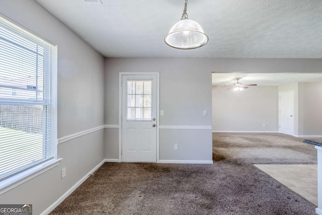 1436 Arbor Place Dr, Morrow, GA 30260 - doorway to outside featuring carpet, a ceiling fan, baseboards, and a textured ceiling