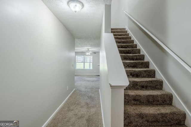 1436 Arbor Place Dr, Morrow, GA 30260 - staircase featuring a textured ceiling, carpet floors, baseboards, and a ceiling fan