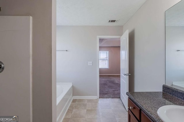 1436 Arbor Place Dr, Morrow, GA 30260 - full bath featuring a garden tub, vanity, baseboards, and tile patterned flooring