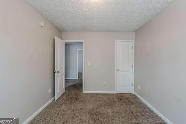 1436 Arbor Place Dr, Morrow, GA 30260 - unfurnished bedroom with a textured ceiling, carpet floors, and baseboards