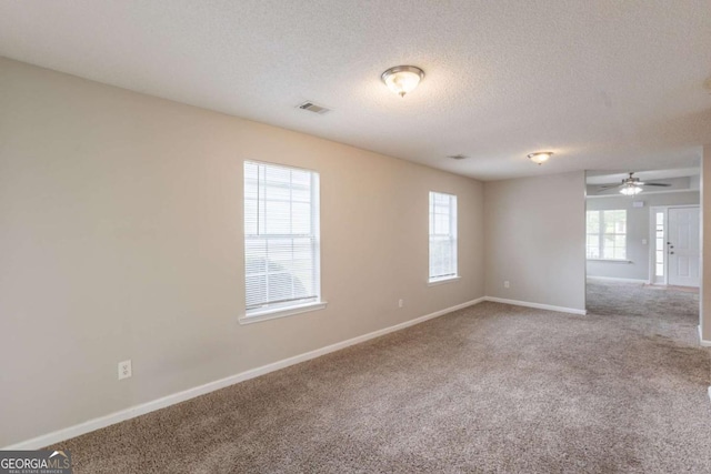 3531 Brookstone Way, Union City, GA 30291 - carpeted empty room featuring a textured ceiling, baseboards, and a ceiling fan
