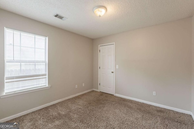 3531 Brookstone Way, Union City, GA 30291 - carpeted spare room featuring a textured ceiling and baseboards