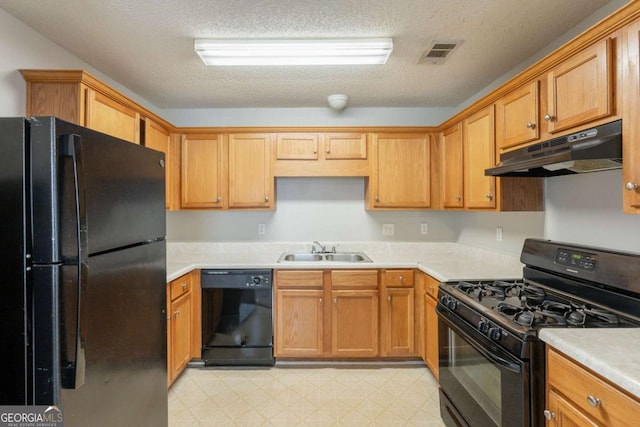 3531 Brookstone Way, Union City, GA 30291 - kitchen with black appliances, under cabinet range hood, a sink, light floors, and light countertops