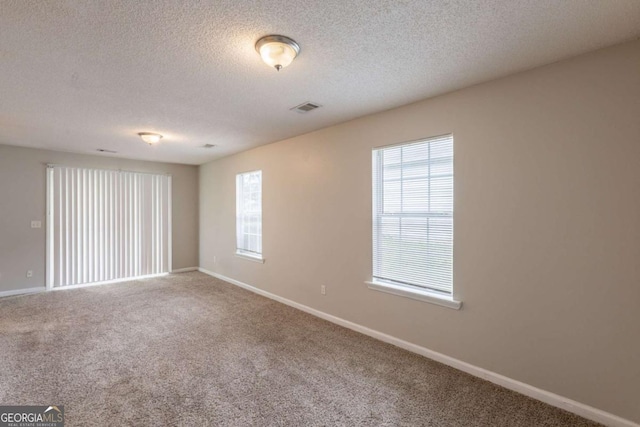 3531 Brookstone Way, Union City, GA 30291 - unfurnished room featuring baseboards, a textured ceiling, and carpet flooring