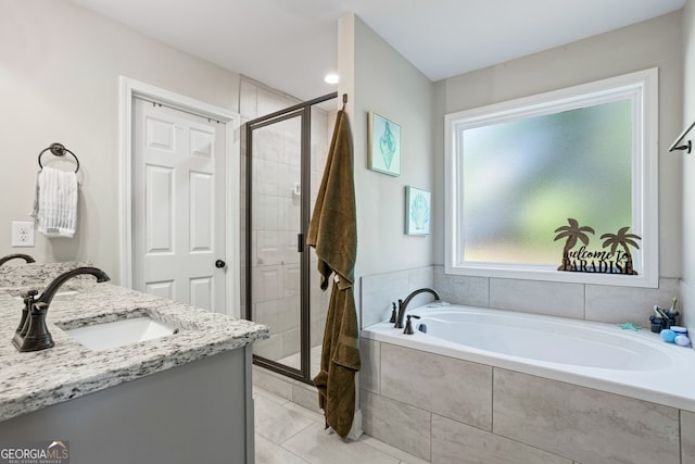 121 Bob Cat Trl, Mansfield, GA 30055 - bathroom with a bath, a shower stall, vanity, and tile patterned flooring
