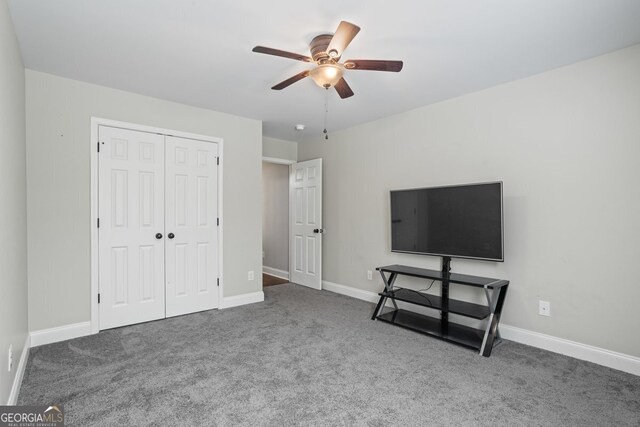 121 Bob Cat Trl, Mansfield, GA 30055 - unfurnished bedroom with carpet flooring, a closet, baseboards, and ceiling fan