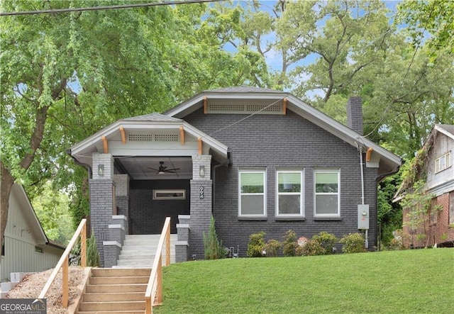 994 Byron Dr SW, Atlanta, GA 30310 - view of front facade with stairs, a front lawn, a chimney, and ceiling fan