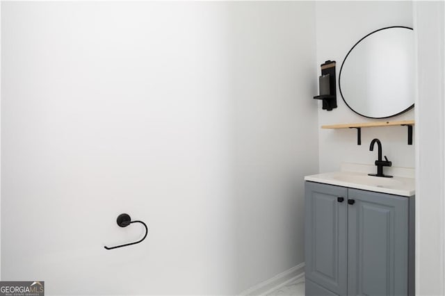 994 Byron Dr SW, Atlanta, GA 30310 - bathroom featuring marble look tiles, vanity, and baseboards