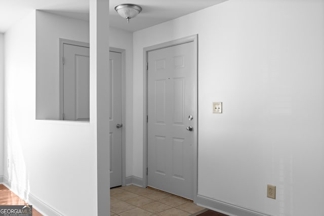 1102 Madison Ln SE, Smyrna, GA 30080 - foyer with light tile patterned floors and baseboards