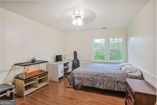bedroom with wood finished floors and ceiling fan