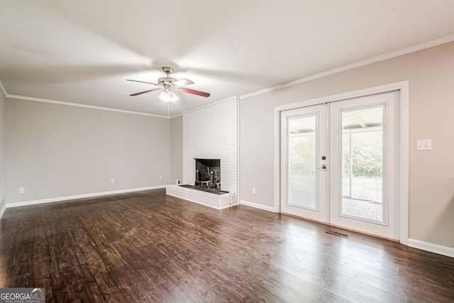 unfurnished living room featuring a ceiling fan, dark wood-style flooring, crown molding, and baseboards