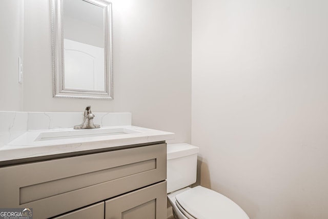bathroom with vanity and toilet
