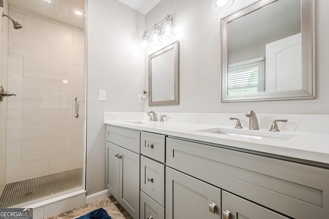 full bath featuring a stall shower and double vanity