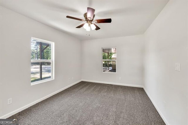 foyer entrance with ceiling fan, wood finished floors, and baseboards