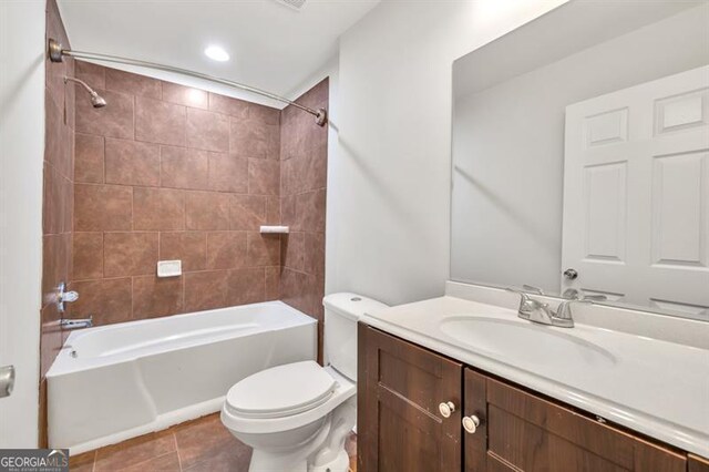 full bathroom with tile patterned flooring, toilet, vanity, and tub / shower combination