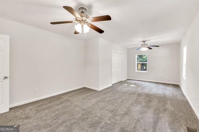 unfurnished living room featuring a ceiling fan, carpet flooring, and baseboards
