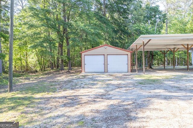 detached garage with a carport