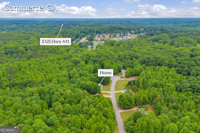 drone / aerial view of a heavily wooded area
