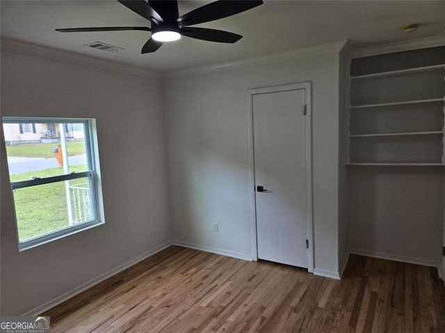 775 Lee Andrews Ave, Atlanta, GA 30315 - unfurnished bedroom with wood finished floors, ornamental molding, baseboards, and ceiling fan