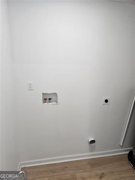 775 Lee Andrews Ave, Atlanta, GA 30315 - washroom with washer hookup, hookup for an electric dryer, wood finished floors, and baseboards