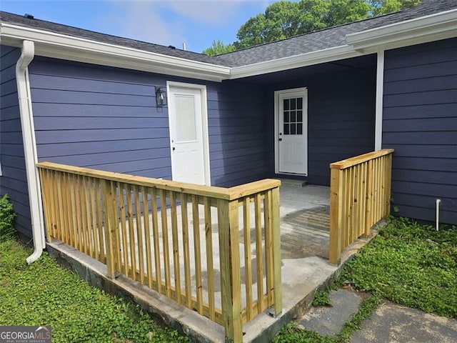 775 Lee Andrews Ave, Atlanta, GA 30315 - view of exterior entry with a wooden deck and a shingled roof