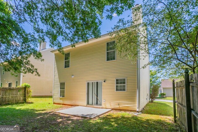 4812 Browns Mill Ferry Rd, Lithonia, GA 30038 - back of house featuring a chimney and a patio area