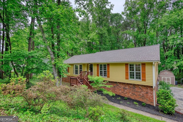 3311 Creek Hollow Dr, Marietta, GA 30062 - ranch-style house featuring a shed and brick siding