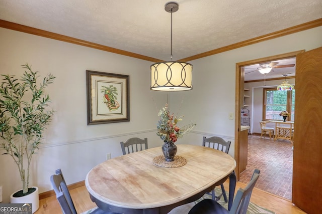 3311 Creek Hollow Dr, Marietta, GA 30062 - dining area featuring a textured ceiling, crown molding, and ceiling fan