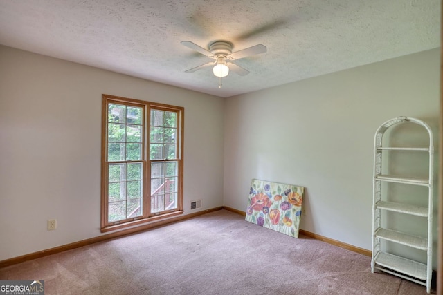 3311 Creek Hollow Dr, Marietta, GA 30062 - empty room featuring carpet, ceiling fan, plenty of natural light, and a textured ceiling