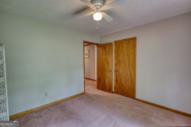 3311 Creek Hollow Dr, Marietta, GA 30062 - unfurnished bedroom featuring carpet floors, a textured ceiling, a ceiling fan, and a closet