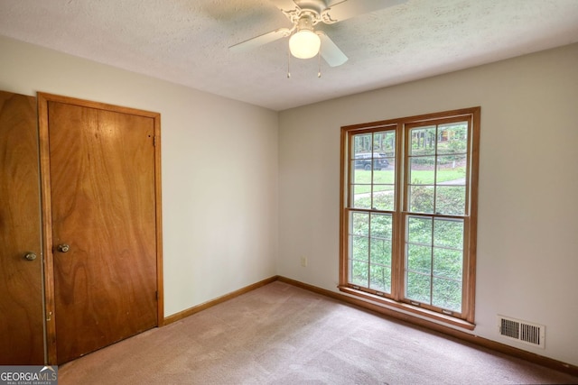 3311 Creek Hollow Dr, Marietta, GA 30062 - unfurnished room featuring light carpet, a textured ceiling, and ceiling fan