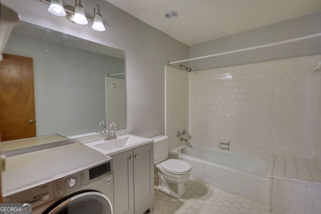 3311 Creek Hollow Dr, Marietta, GA 30062 - full bathroom with washer / clothes dryer, shower / bathtub combination, vanity, and tile patterned floors