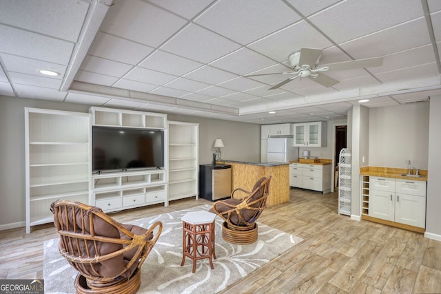 3311 Creek Hollow Dr, Marietta, GA 30062 - living area featuring light wood-style flooring, ceiling fan, and a drop ceiling