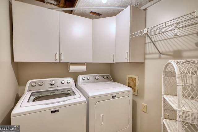 3311 Creek Hollow Dr, Marietta, GA 30062 - laundry room featuring separate washer and dryer and cabinet space