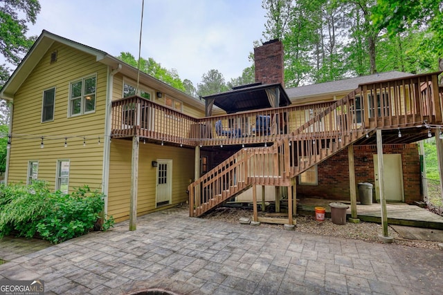 3311 Creek Hollow Dr, Marietta, GA 30062 - rear view of property with a deck, a patio, a chimney, and stairway