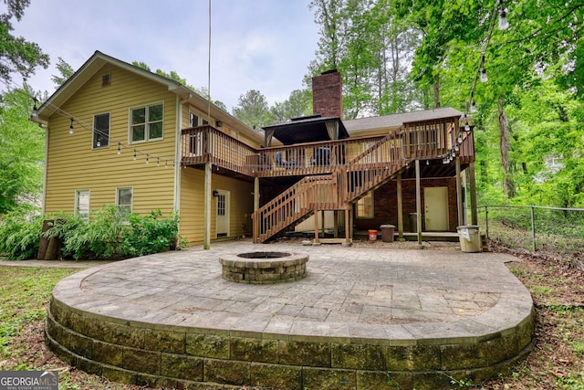 3311 Creek Hollow Dr, Marietta, GA 30062 - back of property with a deck, a patio, stairs, an outdoor fire pit, and a chimney