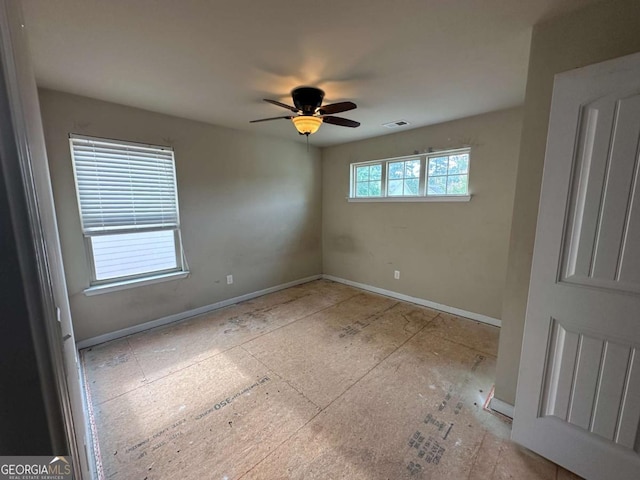 79 Parkmont Ln, Dallas, GA 30132 - unfurnished room featuring ceiling fan and baseboards