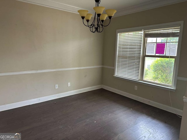 79 Parkmont Ln, Dallas, GA 30132 - unfurnished room with healthy amount of natural light, crown molding, dark wood-style floors, and a chandelier
